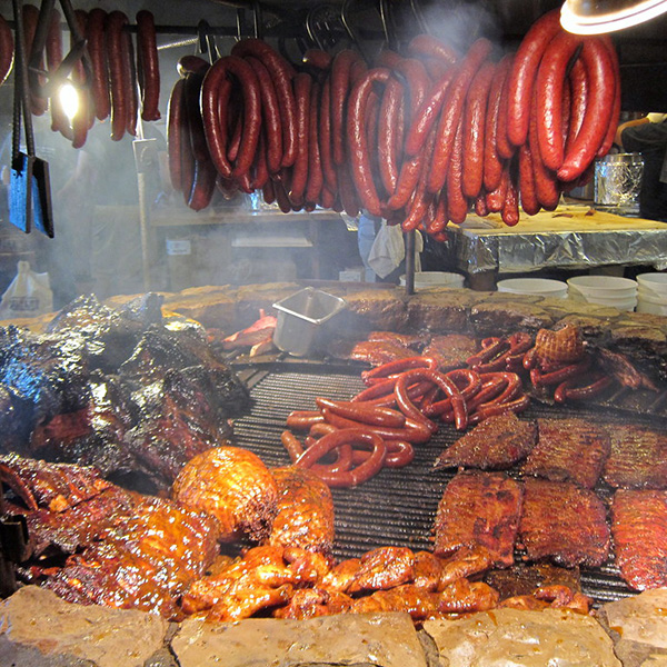 The Salt Lick's world-famous open pit with Brisket, Sausage & Ribs