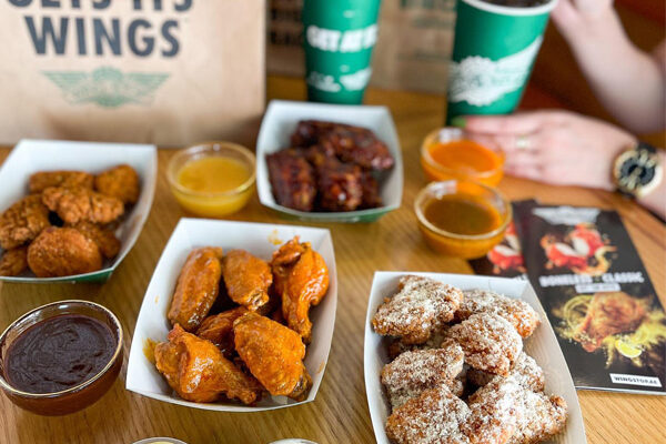 Wingstop entrees on table