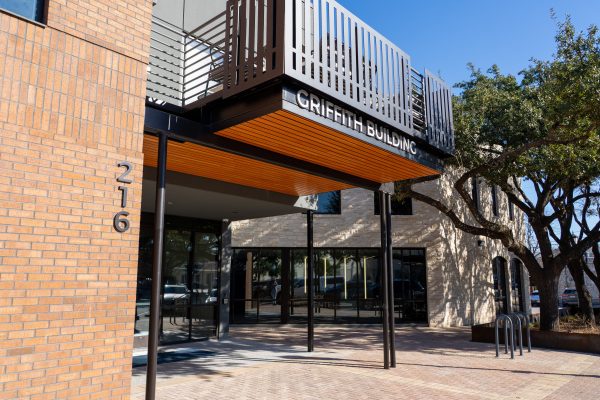 Exterior of the Griffith Building at 216 with modern brick and stone facade.
