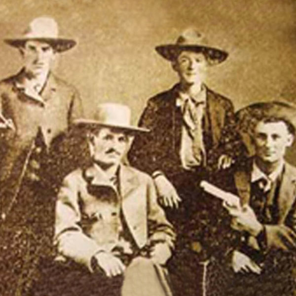 historic picture of men in western outfits