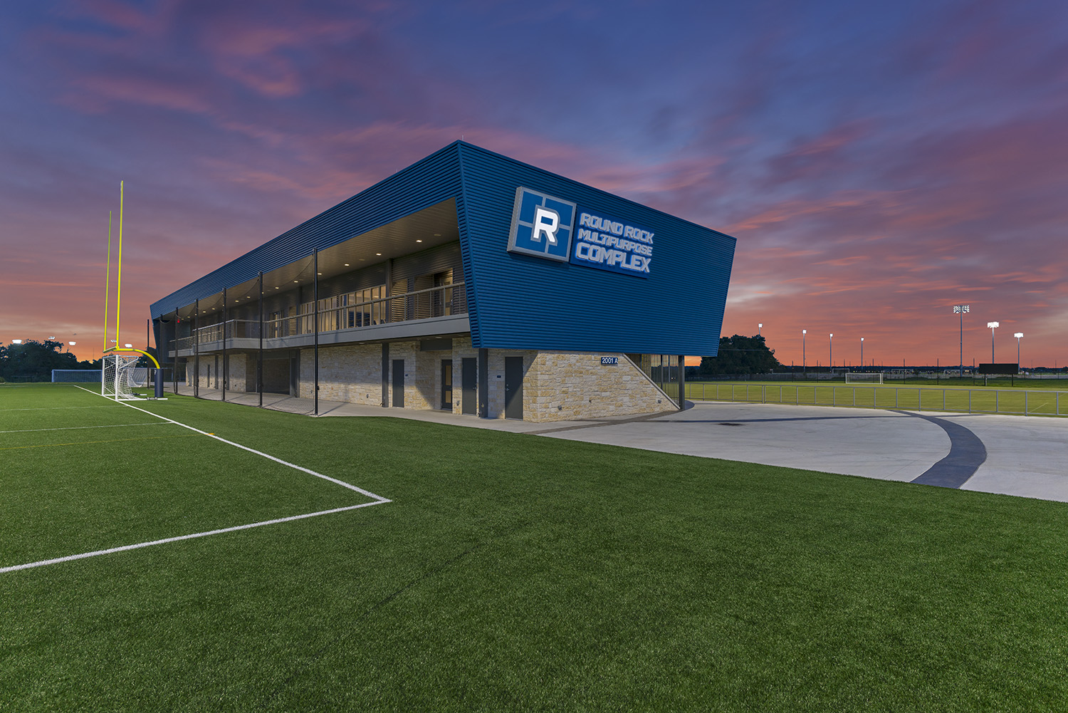 Photo of the Round Rock Multipurpose Complex clubhouse at sunset, part of the family of sports facilities in Round Rock