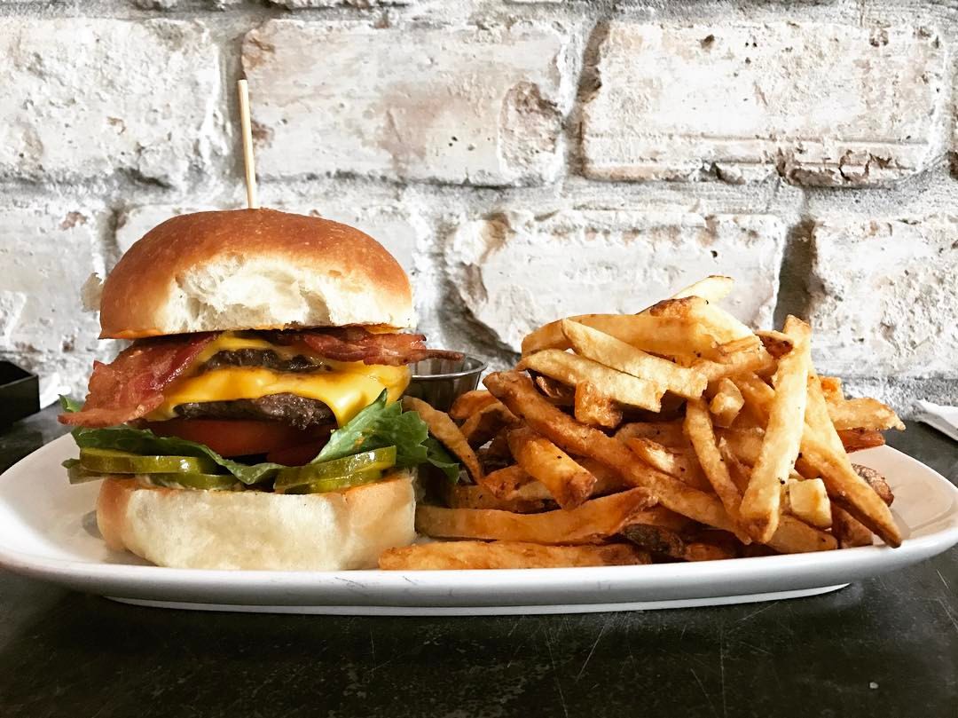 Photo of the Jack Stack Burger with fried at Salt Traders Coastal Cooking in Round Rock Texas