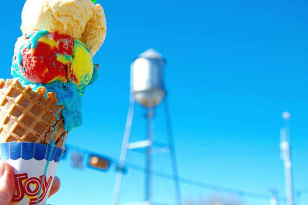 A photo of an ice cream cone from 3 Star Candy Shop in Round Rock Texas with the famous water tower in the background