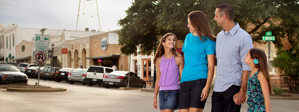 Family walking in downtown Round Rock