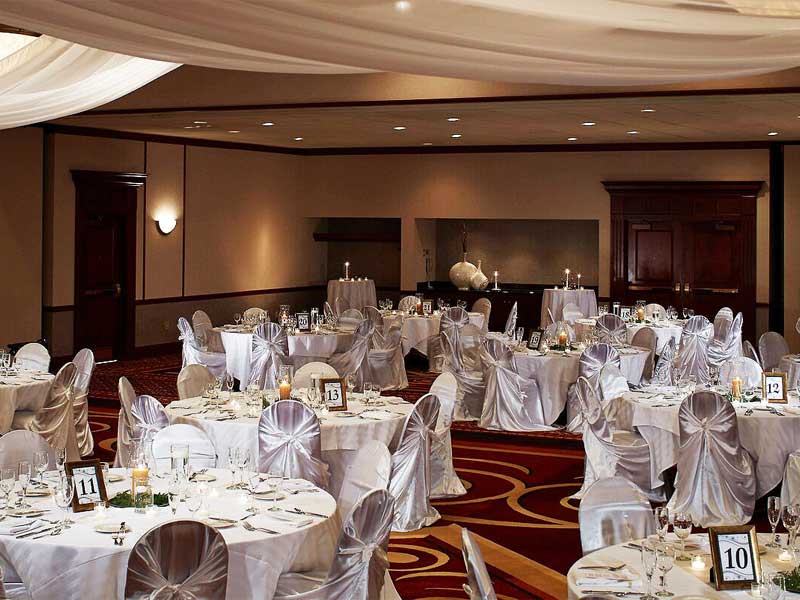 Austin Marriott North Wedding room set up with chairs, tables and wedding decor
