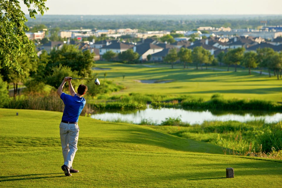 Golfer swinging on Teravista golf course
