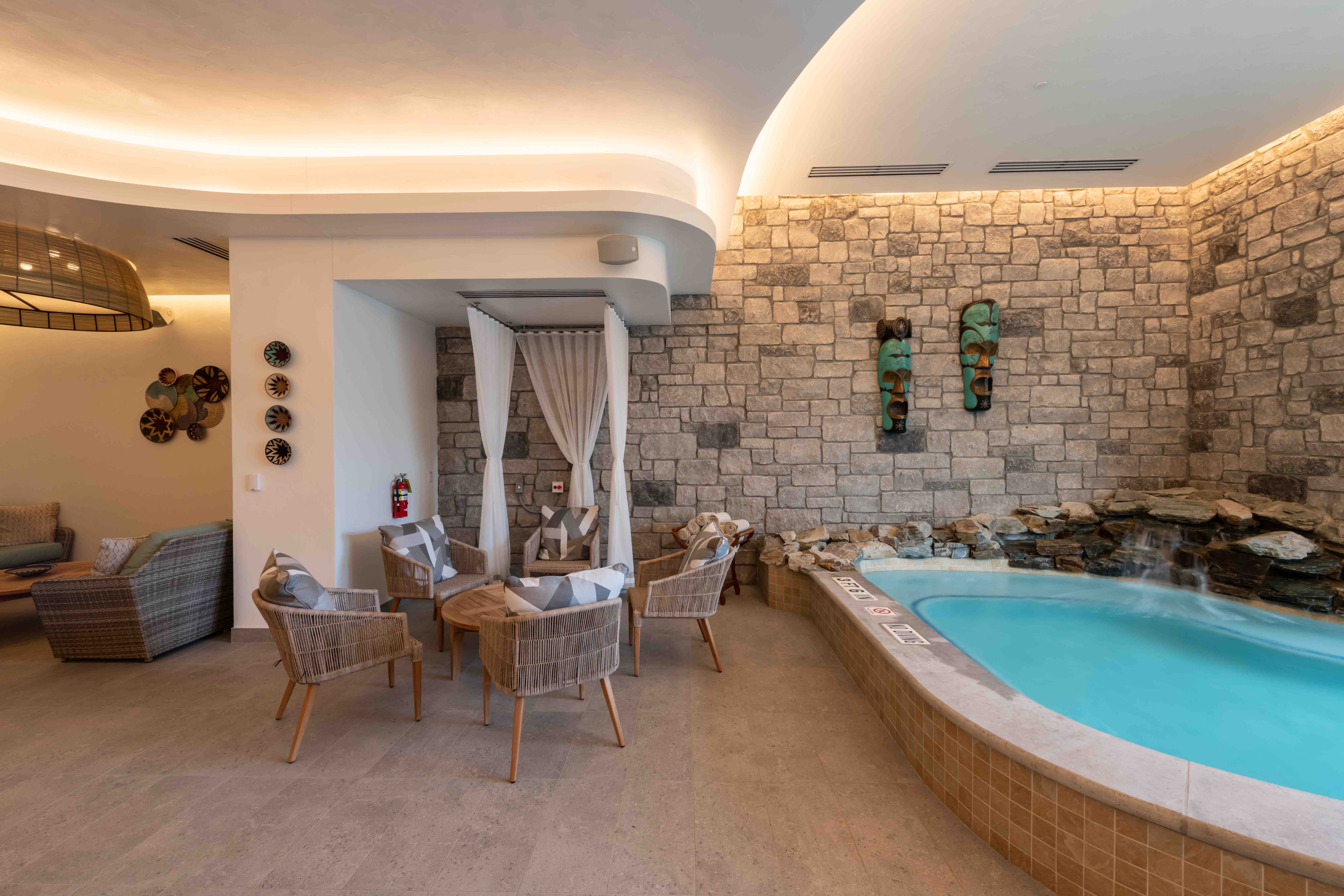 Spa with soaking tub and lounging chairs
