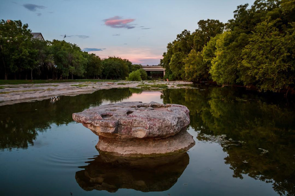 image of the famous round rock in the middle of brush creek. 