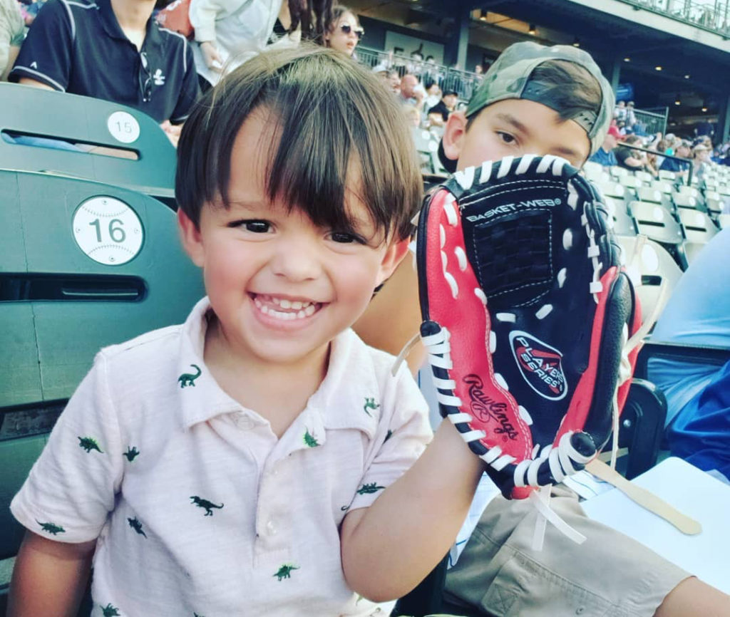 image of a kid with a baseball glove