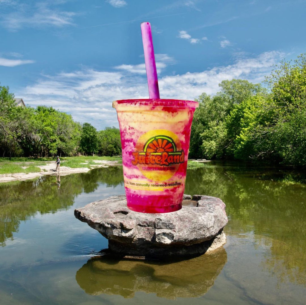 A photo of a smoothie on top of a the famous round rock in brushy creek. 