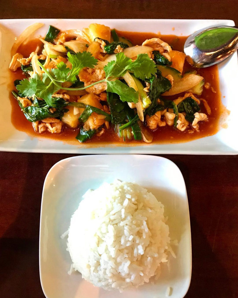 Thai dish with chicken, veggies, and rice. 