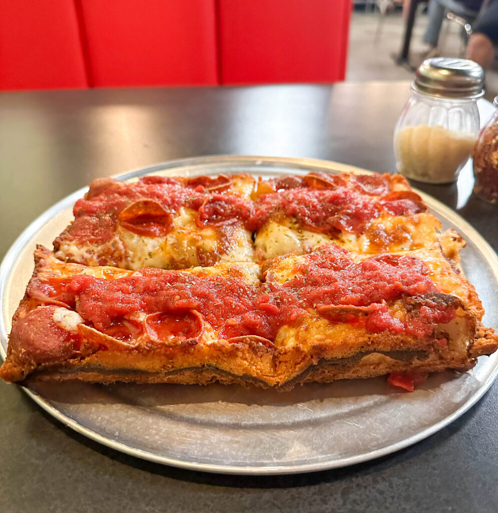 Photo of Detroit style pizza with cheese and pepperoni 