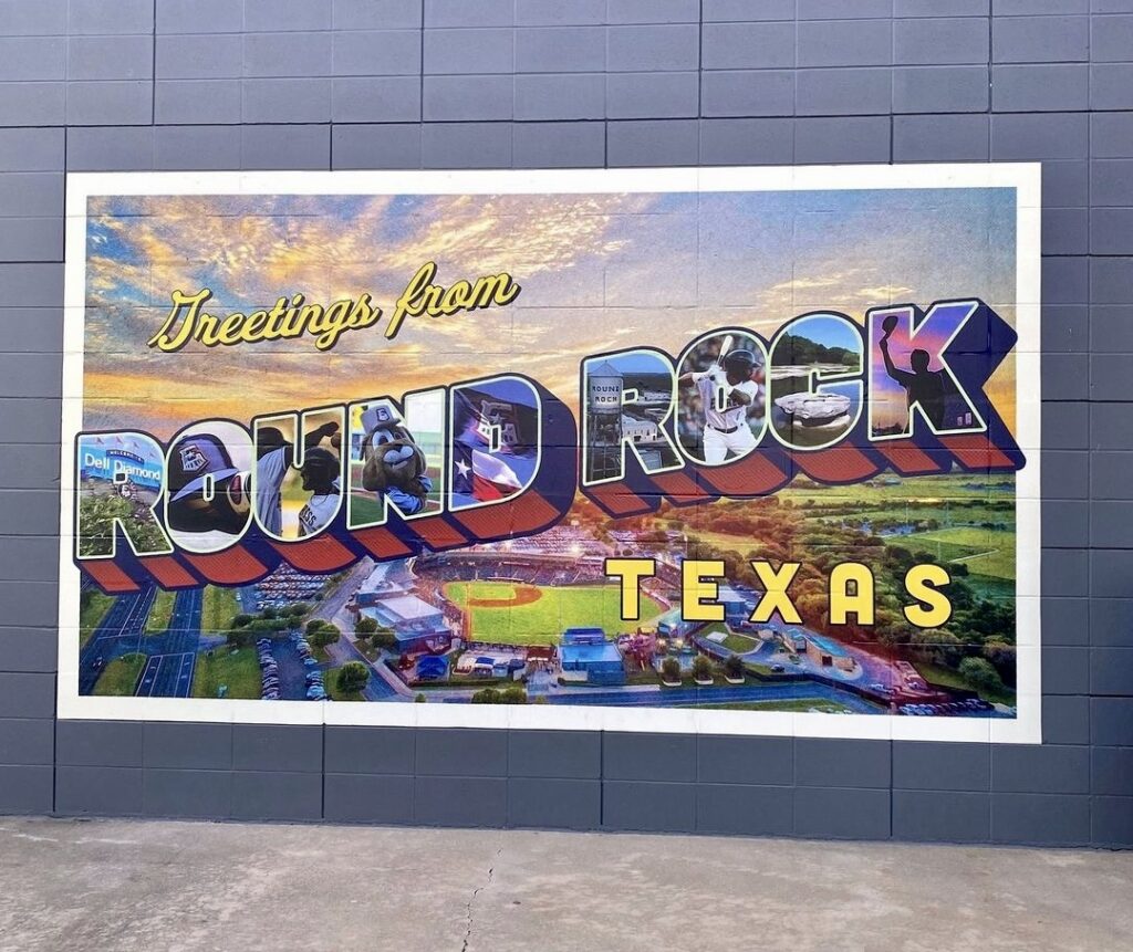 Photo of a post card that says greetings from Round Rock. 