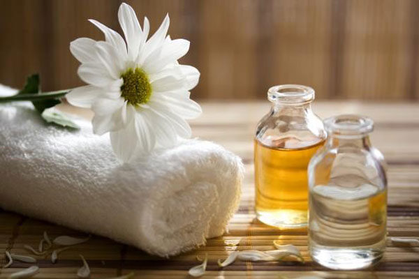 Oil and towels for massage