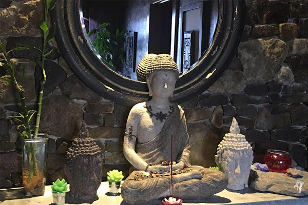 Buddha statue on counter at Zen Relax