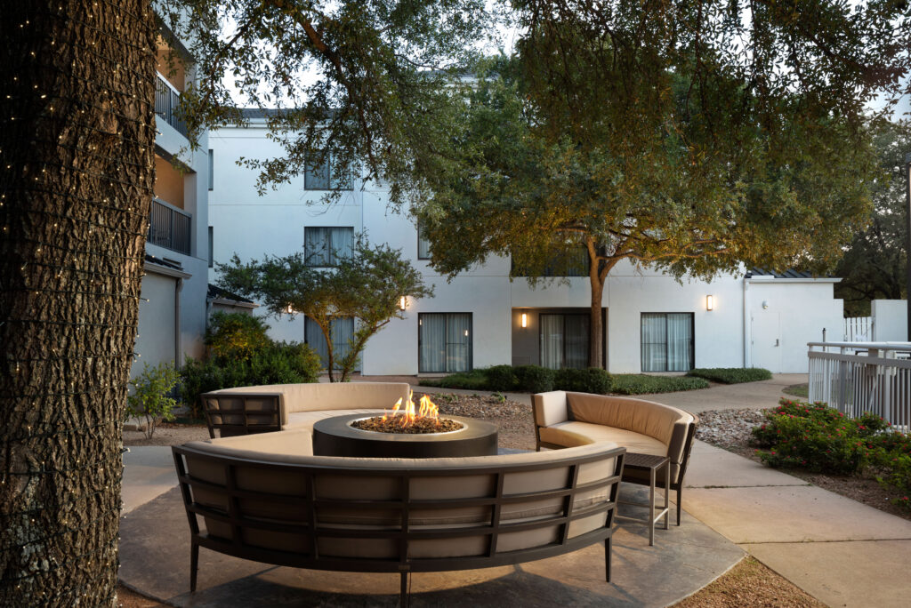 Outdoor courtyard area with a fire pit