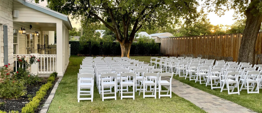 Exterior view of the green lawn with chairs set up