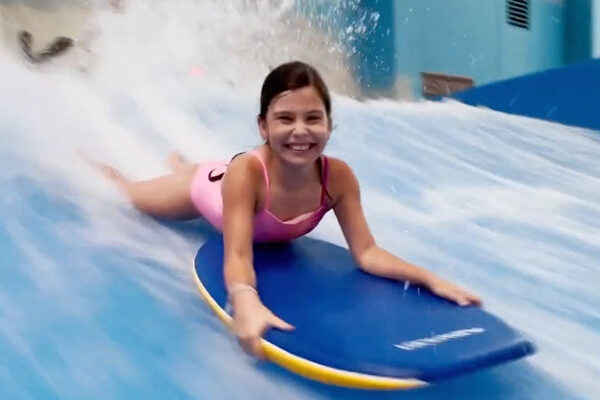 Girl on wakeboard at kalahari resorts in Round Rock
