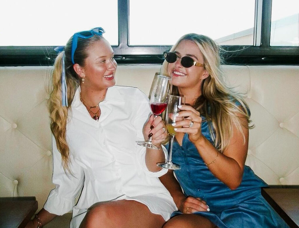 Photo of two women with mimosas. 