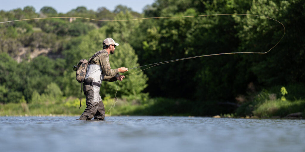 Man casting line as he fly fishes