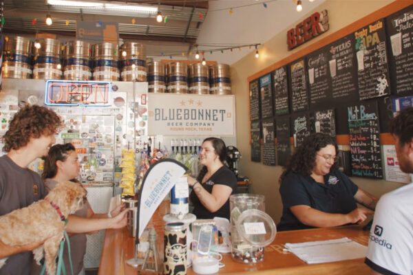 Customers paying at counter at Bluebonnet Brewery