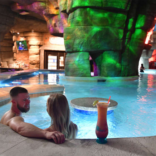 Couple at adult swim up bar