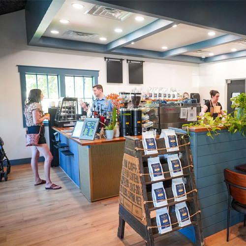 Cashier and customer at coffee shop