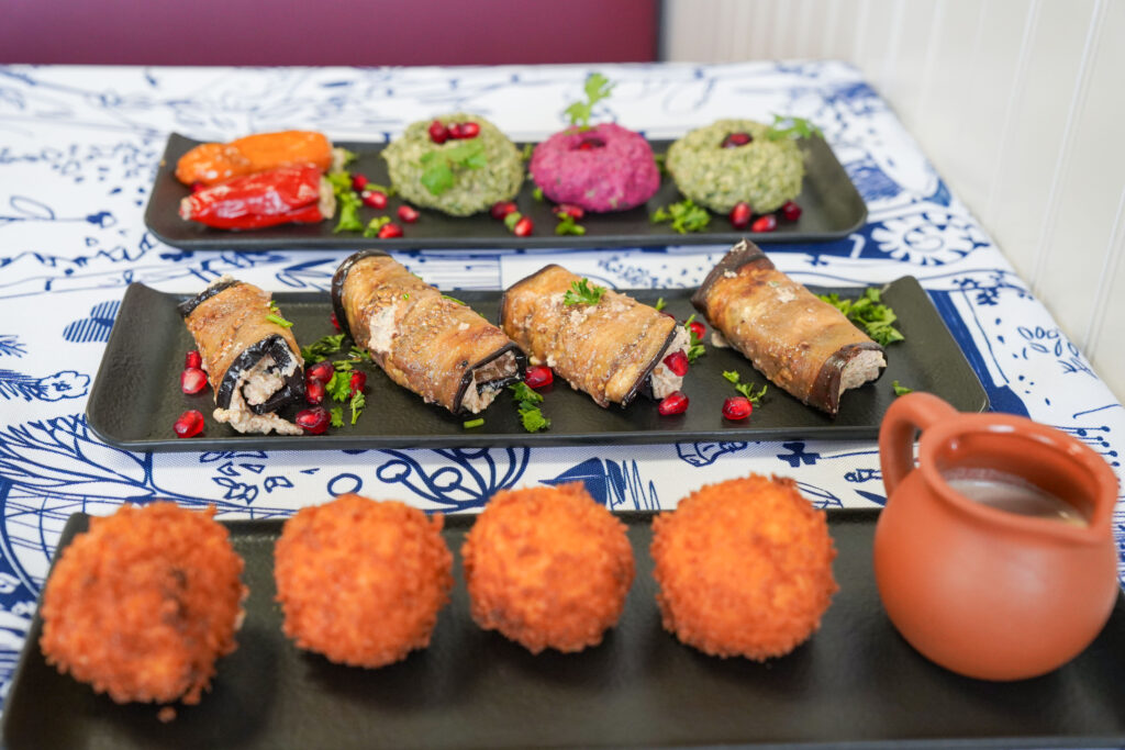 Appetizers Pkhali a combination of spinach, beets, and bell peppers. Seasoned with fragrant walnuts, garlic, fresh greens, and a hint of vinegar)
Eggplant rolls
Elarji balls with walnut sauce (Deep fried cheese grits)