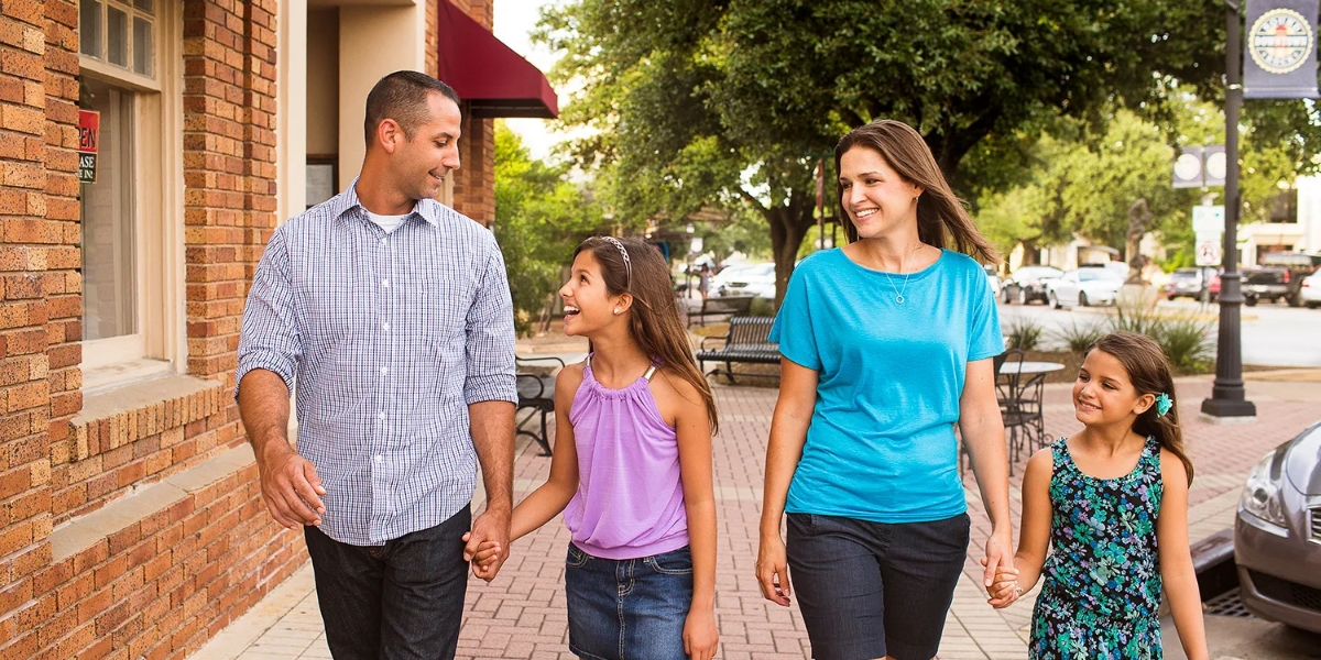 smiling family in downtown Round Rock 