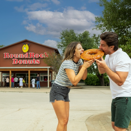 couple eating a donut together