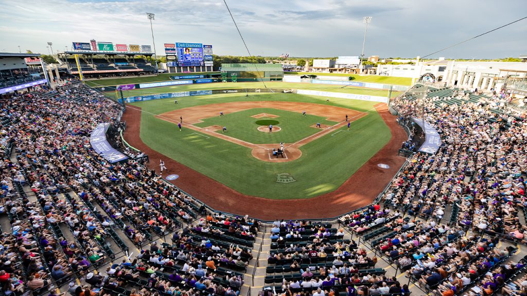 Volts playing softball at the Dell Diamond