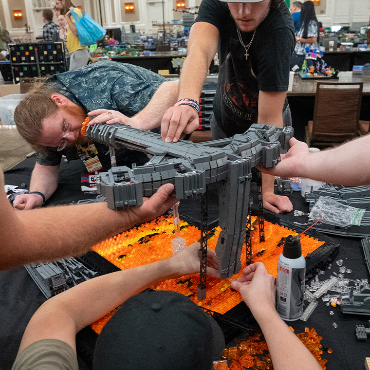 People building lego sculpture together